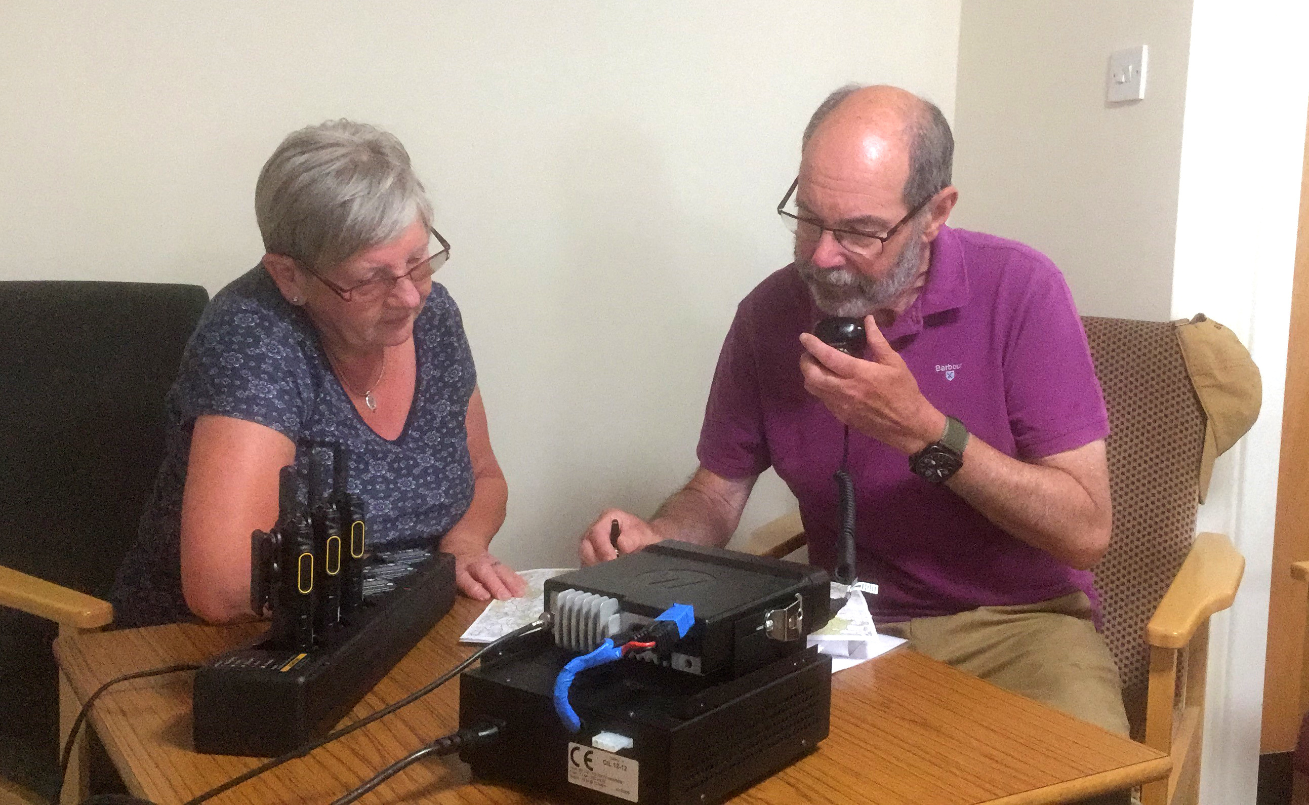 Linda Drever and John Bolton with the new radio system which will keep Ballater residents safe.