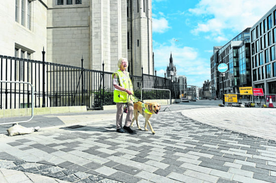 Mary Rasmussen and her guide dog Vince at the Upperkirkgate junction