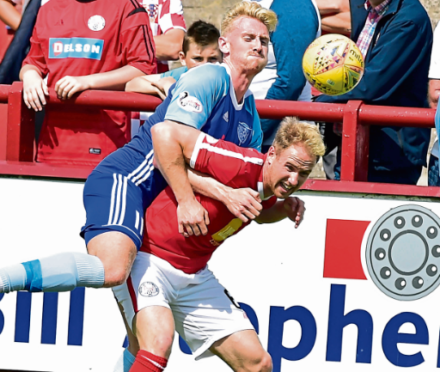 Russell McLean, left, tussles with Brechin City’s Euan Spark