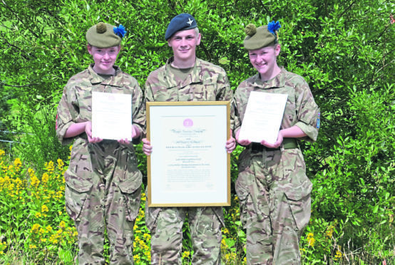 Cadet Jordan Anderson is flanked by sisters Katlyn and Shannon Wilson.