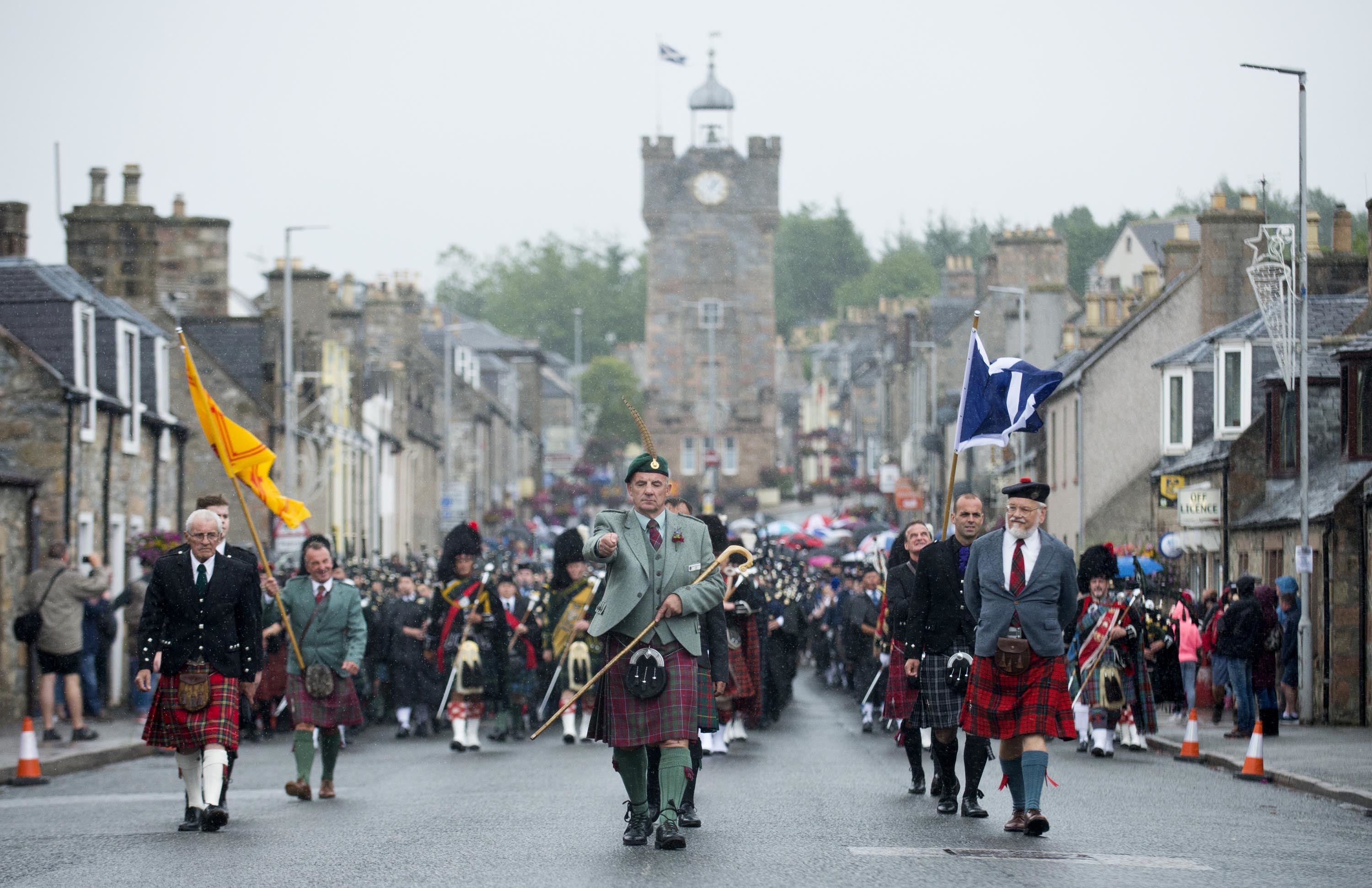 The massed pipes and drums marched from Dufftown's clock tower to the town's Highland Games.