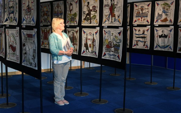 The world famous Diaspora Tapestry is on display at Inveruire Heritage Centre.
Pictured is centre volunteer Carol Robertson getting a sneak preview.
Picture by Chris Sumner.