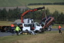 The removal of the two vehicles taking place on the A96.
