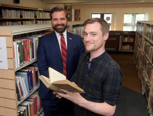 Councillor John Wheeler and Aberdeen Central Library's Dallas King reading a copy of A Window In Thrums. Picture by Kath Flannery