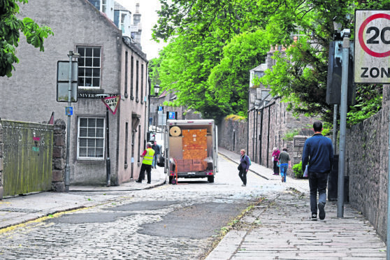 High Street, Old Aberdeen, an ancient cobbled street in the city with tarred patches