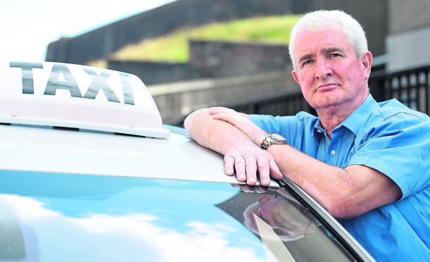 Duncan Fraser, former vice chairman of the Inverness Taxi Alliance who are proposing joining the GMB union photographed in the Castle Wynd taxi rank in the centre of Inverness which is under threat.
Picture by Sandy McCook.
