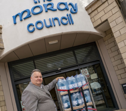 Lead Councilor Graham Leadbitter, with a water supplies.