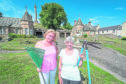 Councillor Maria Mclean (left) and Volunteer Gardener Anne Glover (right) pictured in front of Sulva Cottage at the bottom of Lady Hill, Elgin, Moray.