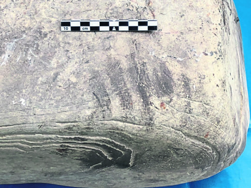 Image of a possible handprint on the stone.
