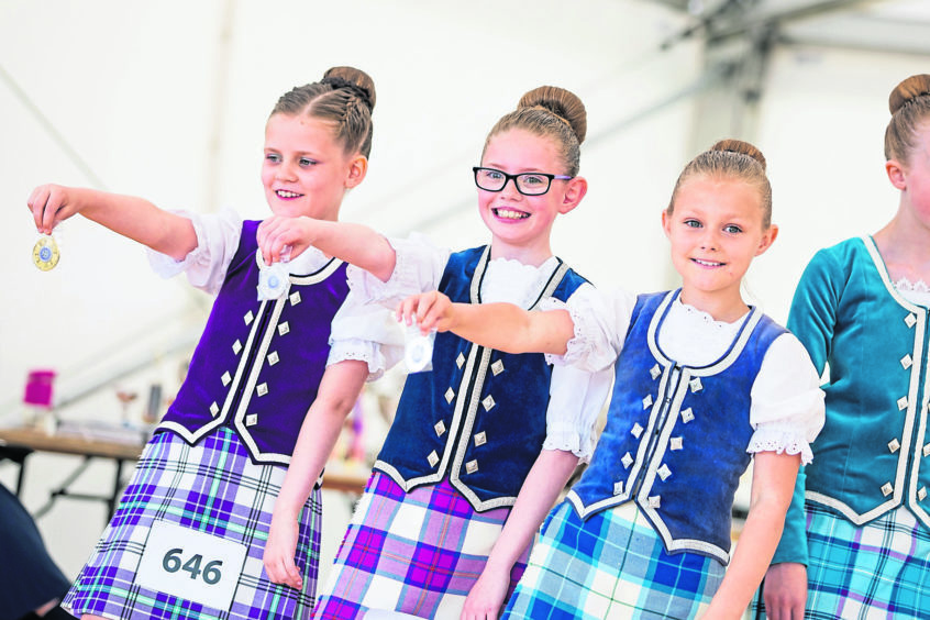 Inverness Highland Games 2018.

The annual games draws a large crowd with many overseas visitors watching and taking part in the games.

Young dancers show their medals inthe Highland Dancing Competition.