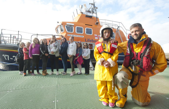 Quarriers support young carers by offering them trips. In photo Brian Forbes from RNLI Buckie lifeboat crew.