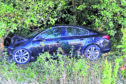 The Vauxhall Insignia which left the road and crashed into trees yesterday.