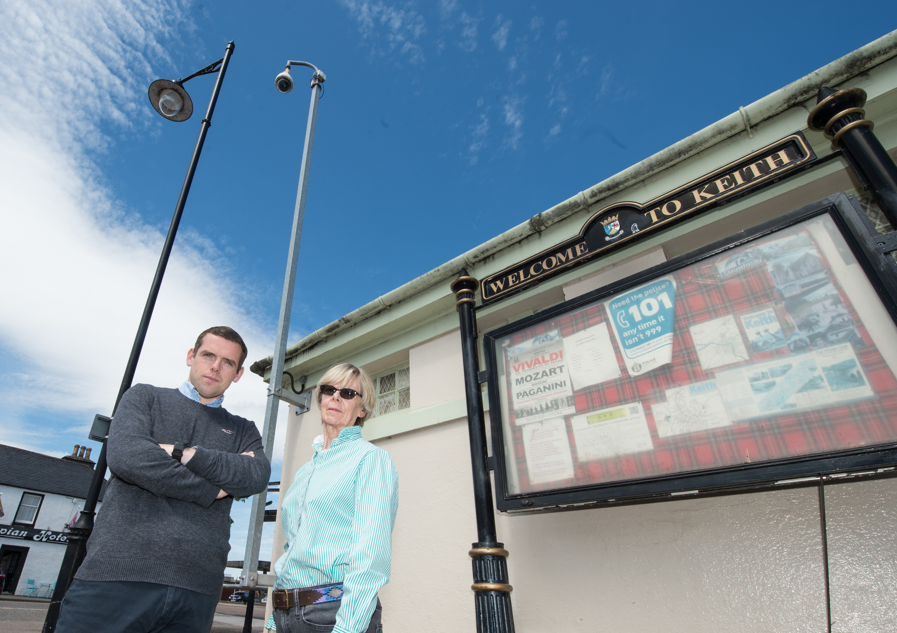 Conservative MP Douglass Ross with Jane Wilson from Fife Keith Action Group underneath the Keith CCTV cameras Picture by Jason Hedges