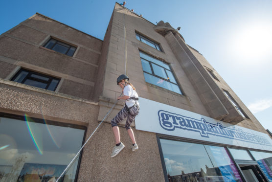 Kacie Dick from Hythe Hill Primary was one of the charity abseilers raising money for Outfit Moray. Picture by Jason Hedges.