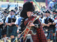 Massed pipe bands at the Forres Highland Games.