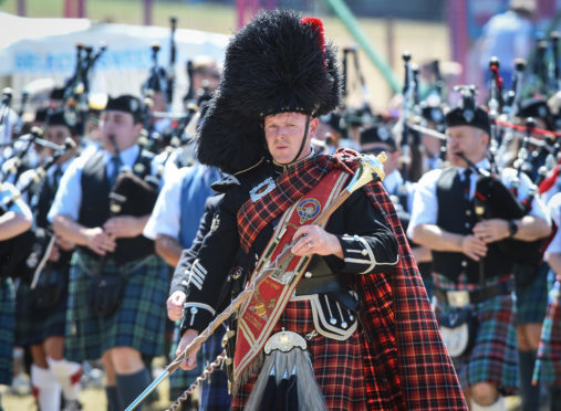 Massed pipe bands at the Forres Highland Games.