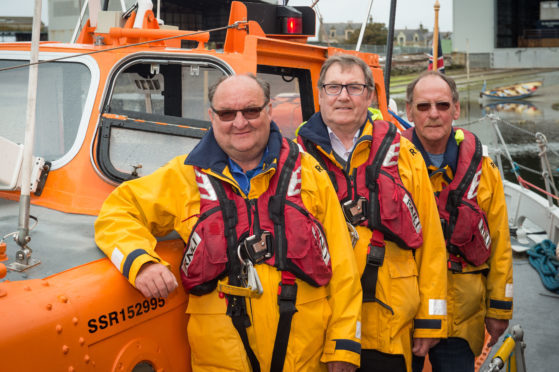 Lifeboat Crew of Laura Moncur - John (Jake) Murray 2nd Coxain, Geddes Wood, Navigator and Radio operator, Kenny Farquhar, Bow man.
