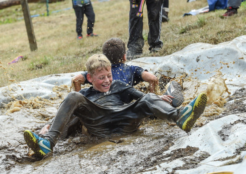 Picture by JASON HEDGES

Cotestants compete in this years Mortlach Mud Mayhem - 'Mudder' event in Dufftown, Moray.