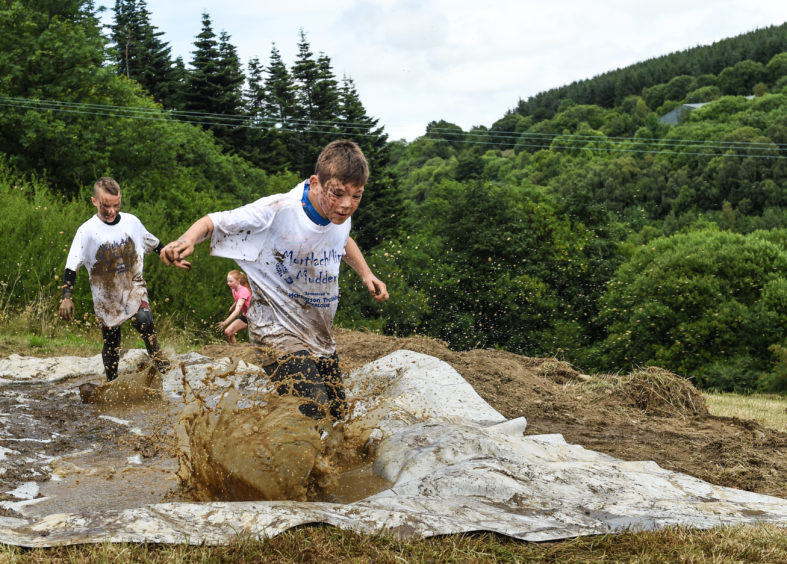 Picture by JASON HEDGES

Cotestants compete in this years Mortlach Mud Mayhem - 'Mudder' event in Dufftown, Moray.