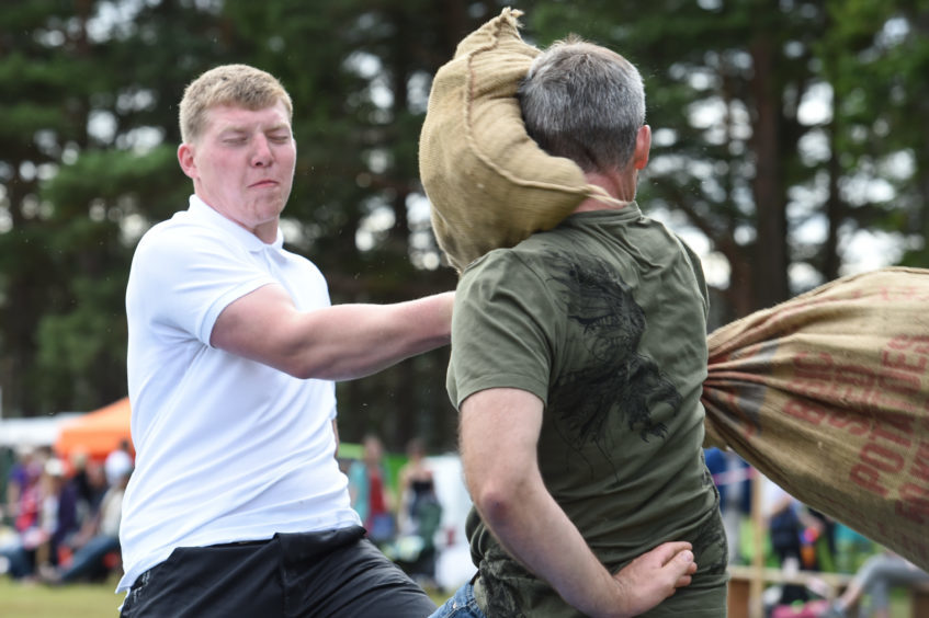 Picture by JASON HEDGES 

Pictures show the sporting events of Tomintoul, 2018 Highland Games.

Picture: Charlie Mitchell (white) goes all out to win this years Pillow Fight!