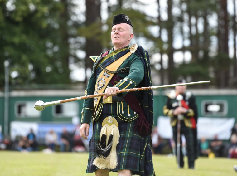 Picture by JASON HEDGES 

Pictures show the sporting events of Tomintoul, 2018 Highland Games.

Picture: Derek Dean from Huntly winds the Drum Majors Challenge.