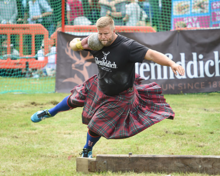 A shot put competitor at the Tomintoul Highland Games.