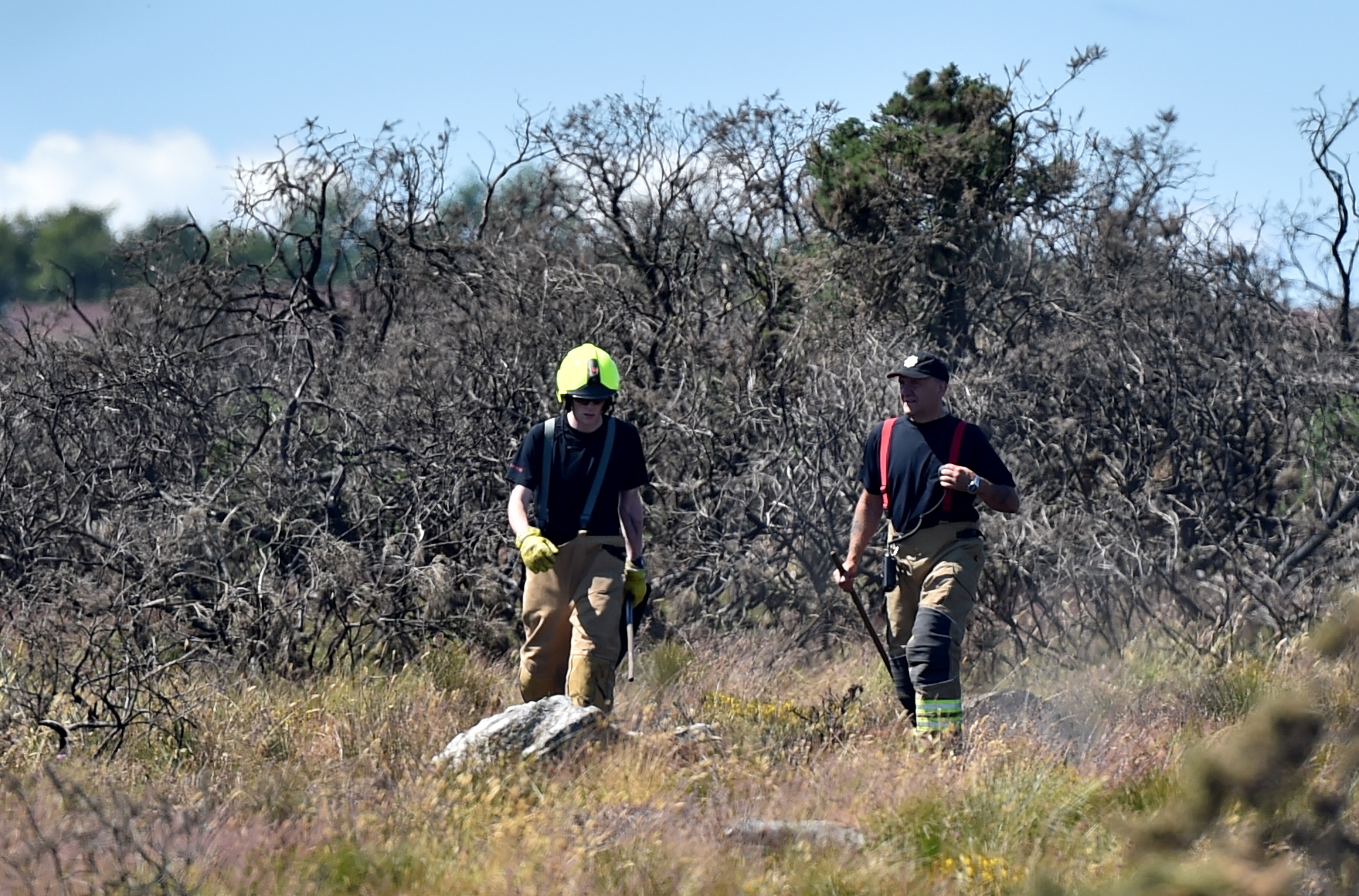Fire crews were called back to a wildfire between Kingwells and Bucksburn yesterday.

Bucksburn Valley Paths fire, 4th July, 2018. Two firefighters investigate the Bucksburn Valley Paths.



Picture by Scott Baxter    04/07/2018