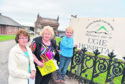 Gina Buchan, Ann Shreeve and Caleb Buchan are protesting the closure.