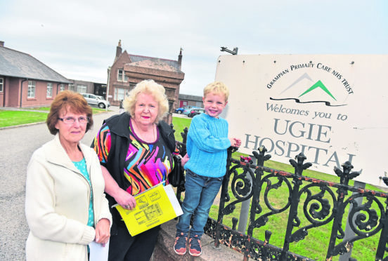 Gina Buchan, Ann Shreeve and Caleb Buchan are protesting the closure.