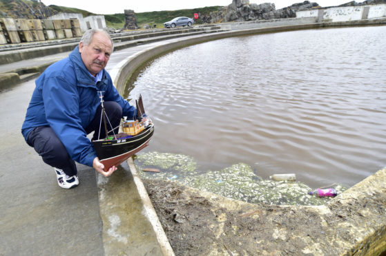 Alex Oldman with one of his model boats at Tarlair swimming pool