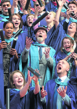 Scottish actor Peter Mullan larks around with pupils as he receives a honorary degrees from the Royal Conservatoire of Music in Glasgow. July 5, 2018. Peterhead-born Mullan has starred in Trainspotting, War Horse and My name is Jo.