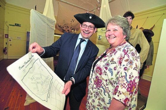 Peterhead Bid manager Ian Sutherland and councillor Anne Stirling with the Peterhead treasure map