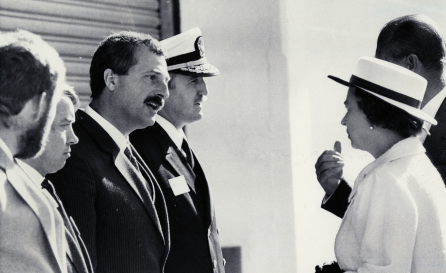 The Queen meeting Iain Letham, Capt Alistair Letty, Stanley MacLeod and Admiral John Redd, four men who had a key role in the Piper Alpha rescue operation, in Aberdeen on August 15 1988.