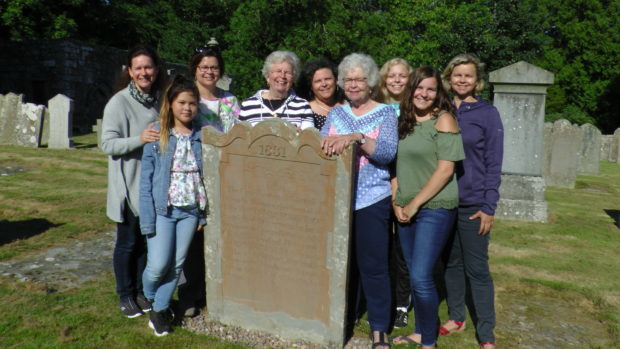 Katherine Downey, fourth from right, and other descendants of James Robertson at the gravestone