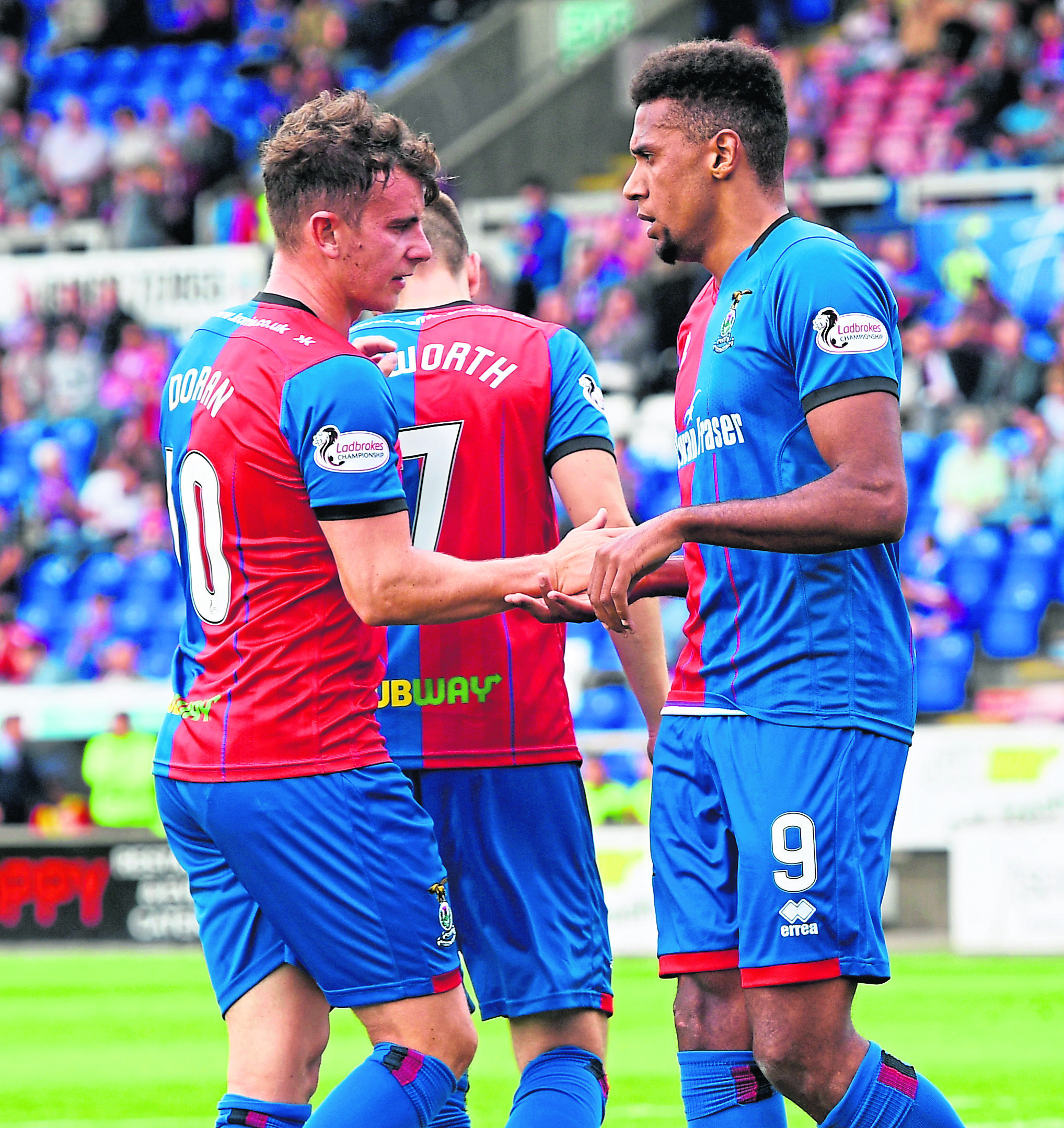 Aaron Doran congratules Nathan Austin after he made it 2-0 for Caley Thistle