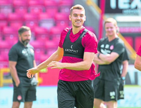 Tommie Hoban trains with the Dons yesterday and looks set for a European debut tonight.