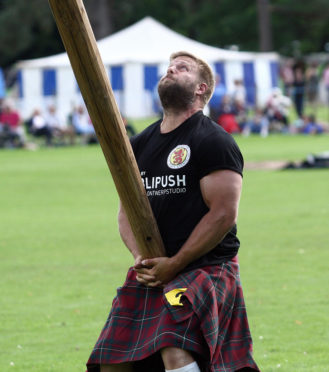 A delighted Scott Ryder England World Champion Caber Tosser Inveraray Highland games.  Scott lost his title to Lorne Colthart from Blair Atholl in 2017 but was delighted to win back the title for 2018.