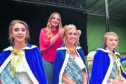 Local author Estelle Maskame crowns Buchan queen Natasha Clueit attended by princesses Rhiannah Slamaker (L) and Rachel Calder to start Peterhead Scottish Week in 2018. Natasha will reprise the role for this year's virtual events.