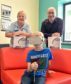 Alfie tries out the new games with the help of play specialist Helen MacCuish and Orion IT Director Duncan Murray. 
Picture by COLIN RENNIE