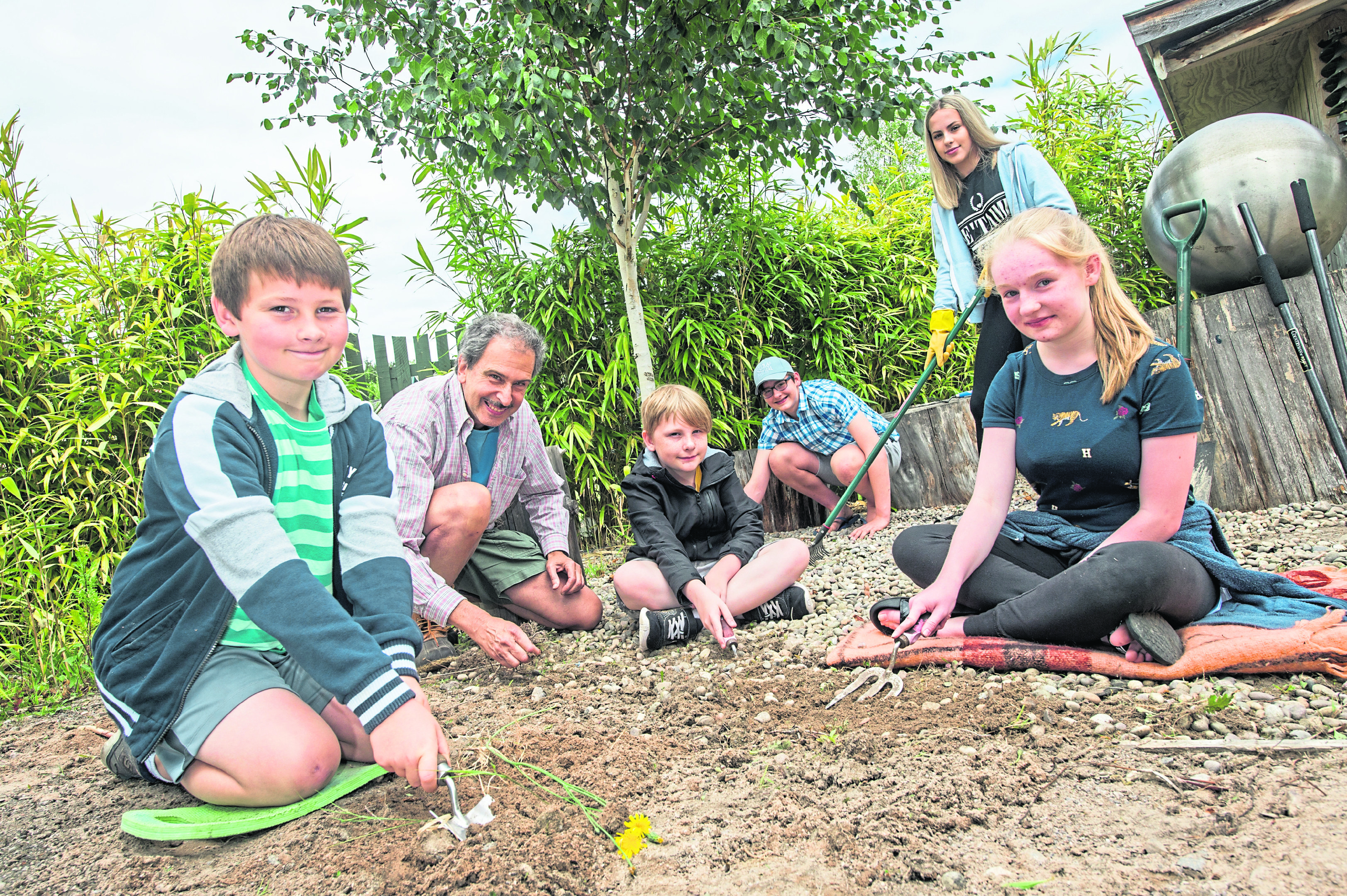 Children and adults alike volunteer to help tidy up the garden at Moray Arts Centre, Findhorn.

Picture by Jason Hedges.
