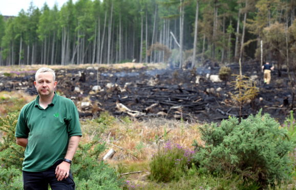 Dan Cadle of Forrest Enterprise Scotland at the scene of a gorse fire on the walk to the Mither Tap at Bennachie from the visitor centre.  
Picture by Kami Thomson    08-07-18
