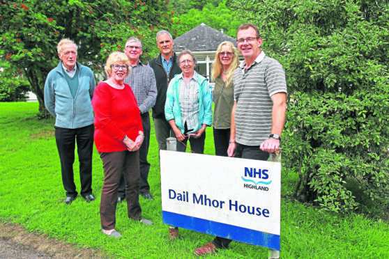 The committee of the Joint Community Councils Dail Mhor Working Group outside the Home with Chairman James Hilder on the right.