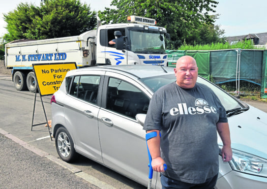 Ian Armstrong outside his home.
Picture by Scott Baxter.