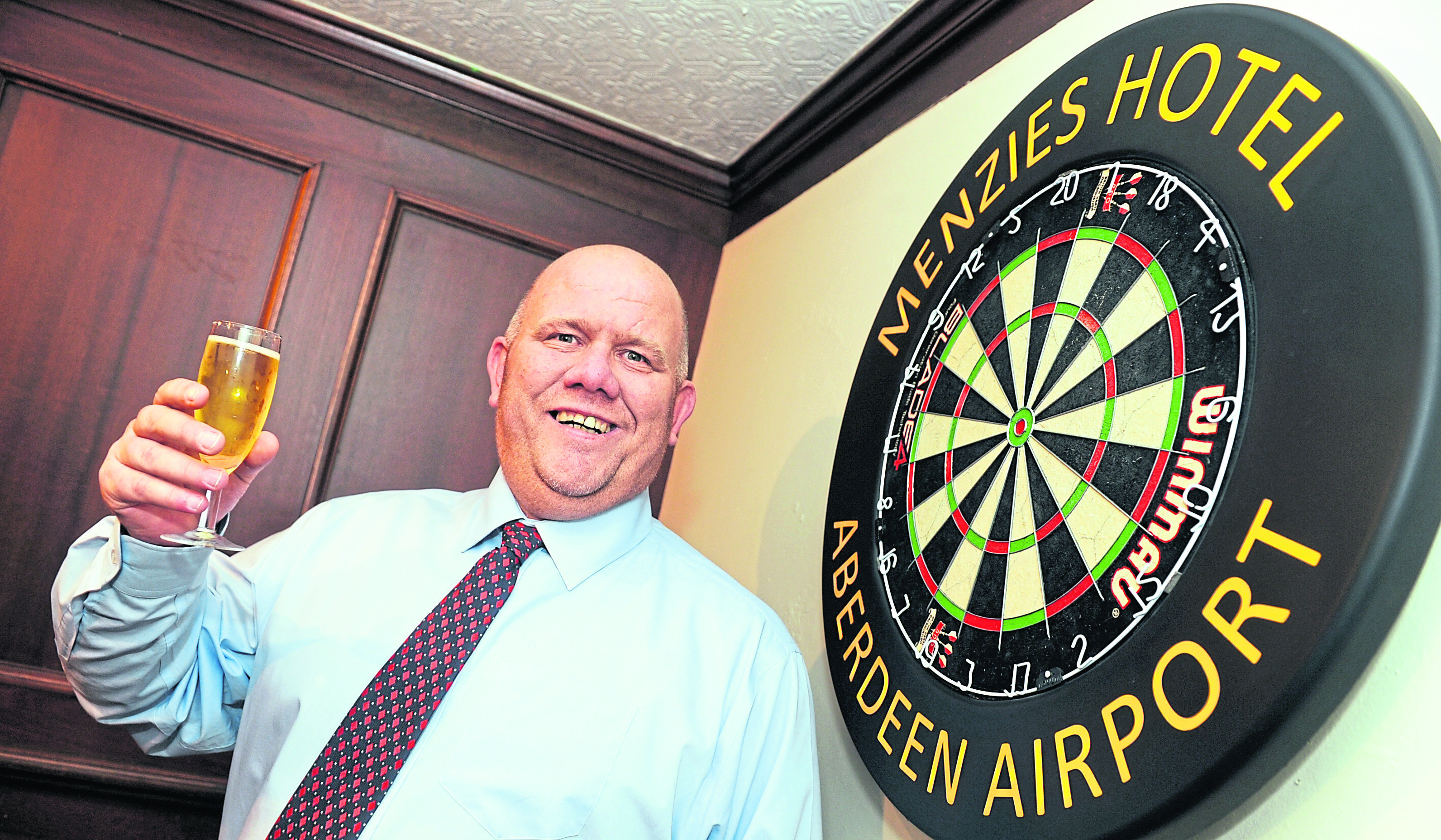 Chairman of the board: Derek Weston, an organiser and men’s team manager for Grampian Darts Association, toasts what he is sure will be an action-packed event.