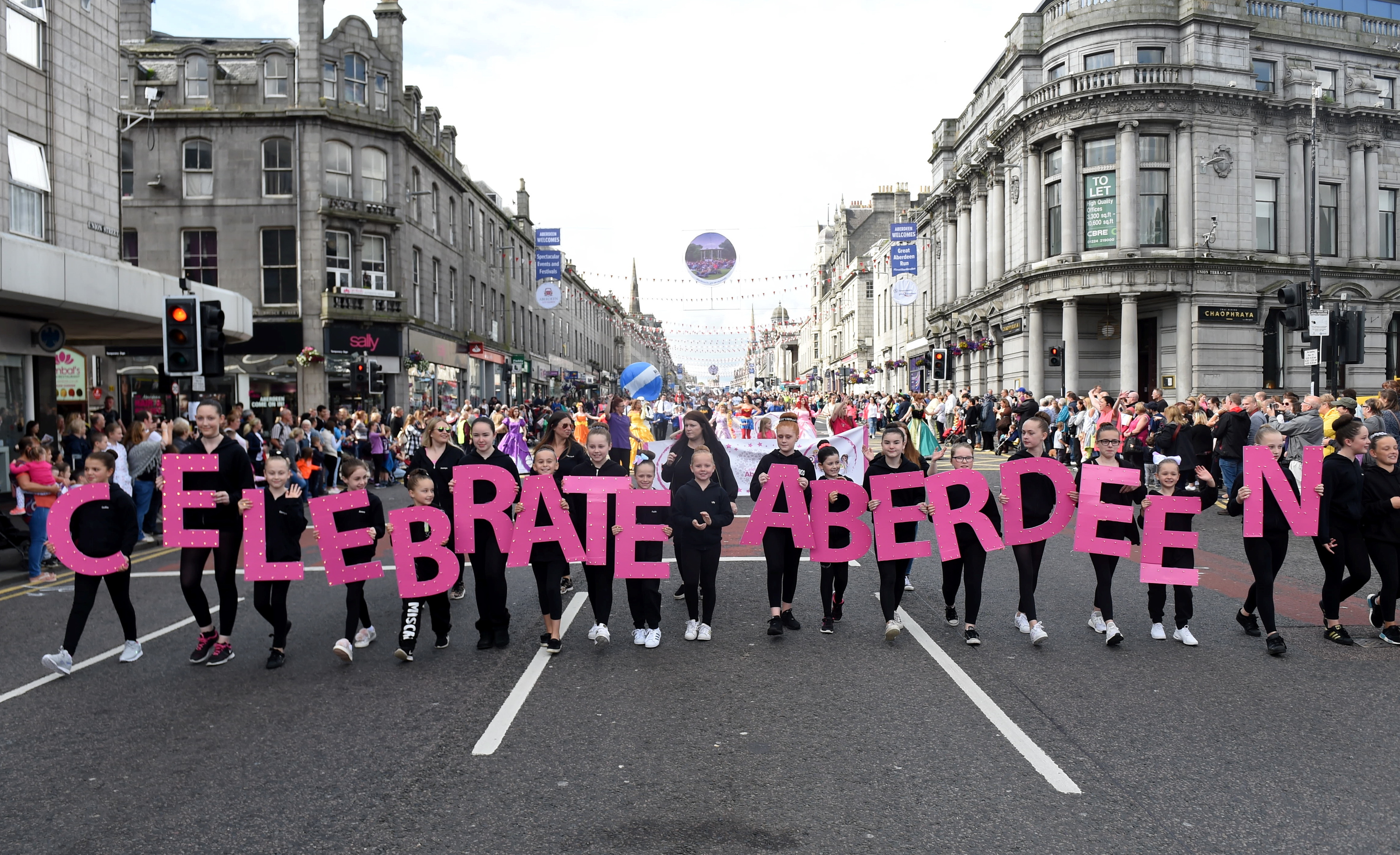 Volunteers walk down Union Street to mark Celebrate Aberdeen.