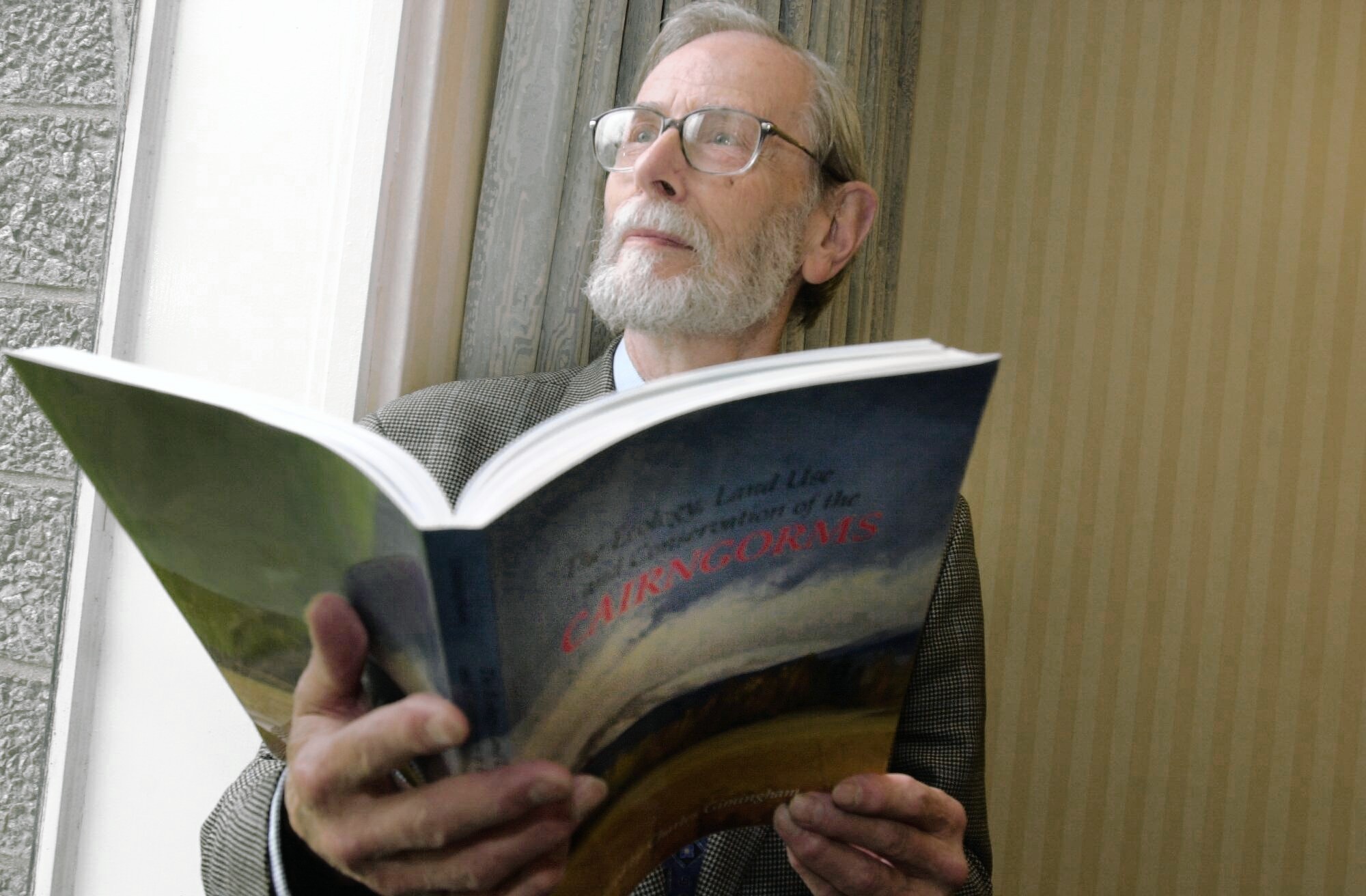 Professor Charles Gimingham with a copy of The Cairngorms, which he edited in 2002.