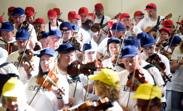 More than 300 people gathered at Mackie Academy in an attempt to break the world record for the largest ever ceilidh band. Picture by Jim Irvine