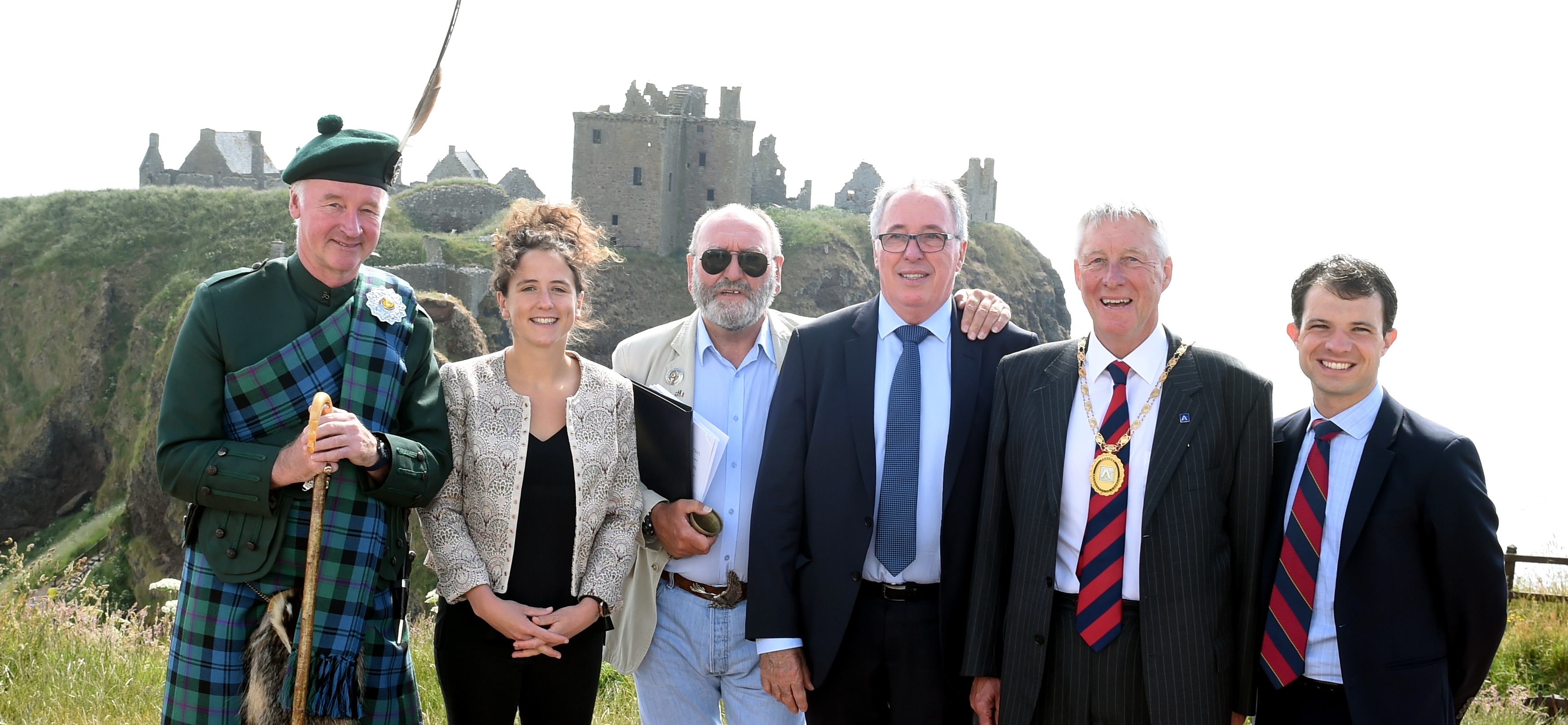 The French town of Acheres, twinning committee visited Stonehaven and the Dunnottar castle. In the picture are members of both committe's. From left are Richard Holman-Baird, Mairi Gougeon, Phil Mills-Bishop, Marc Honore, Mayor of Acheres: provost, Bill Howatson and Andrew Bowie. 
Picture by Jim Irvine  7-7-18