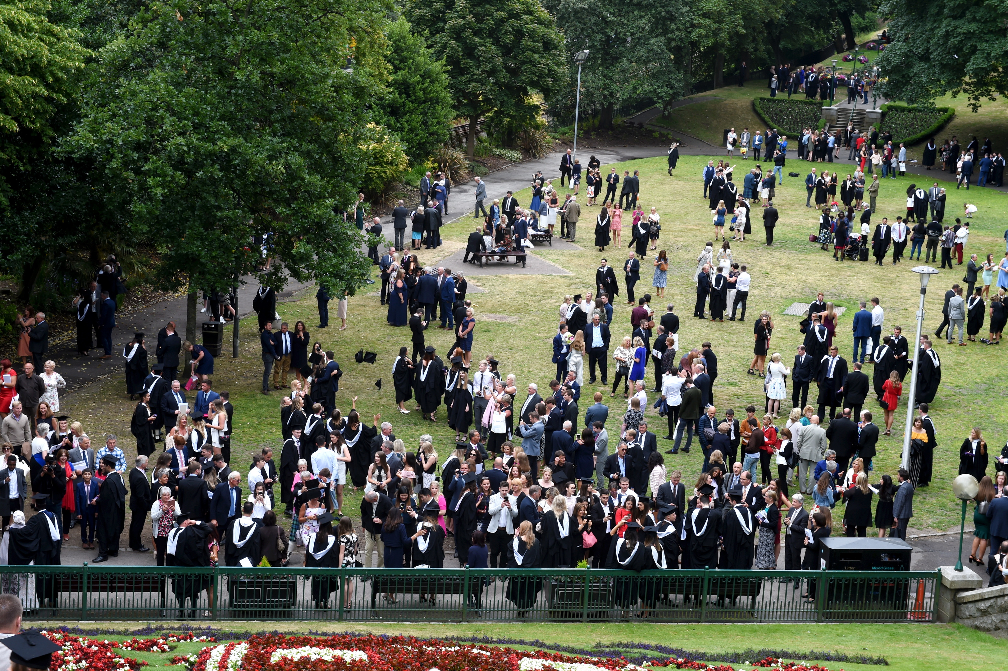 Robert Gordon university graduates at HMT, Aberdeen. In the picture graduates and families congregate in the Union Terrace gardens.  
Picture by Jim Irvine  10-7-18
