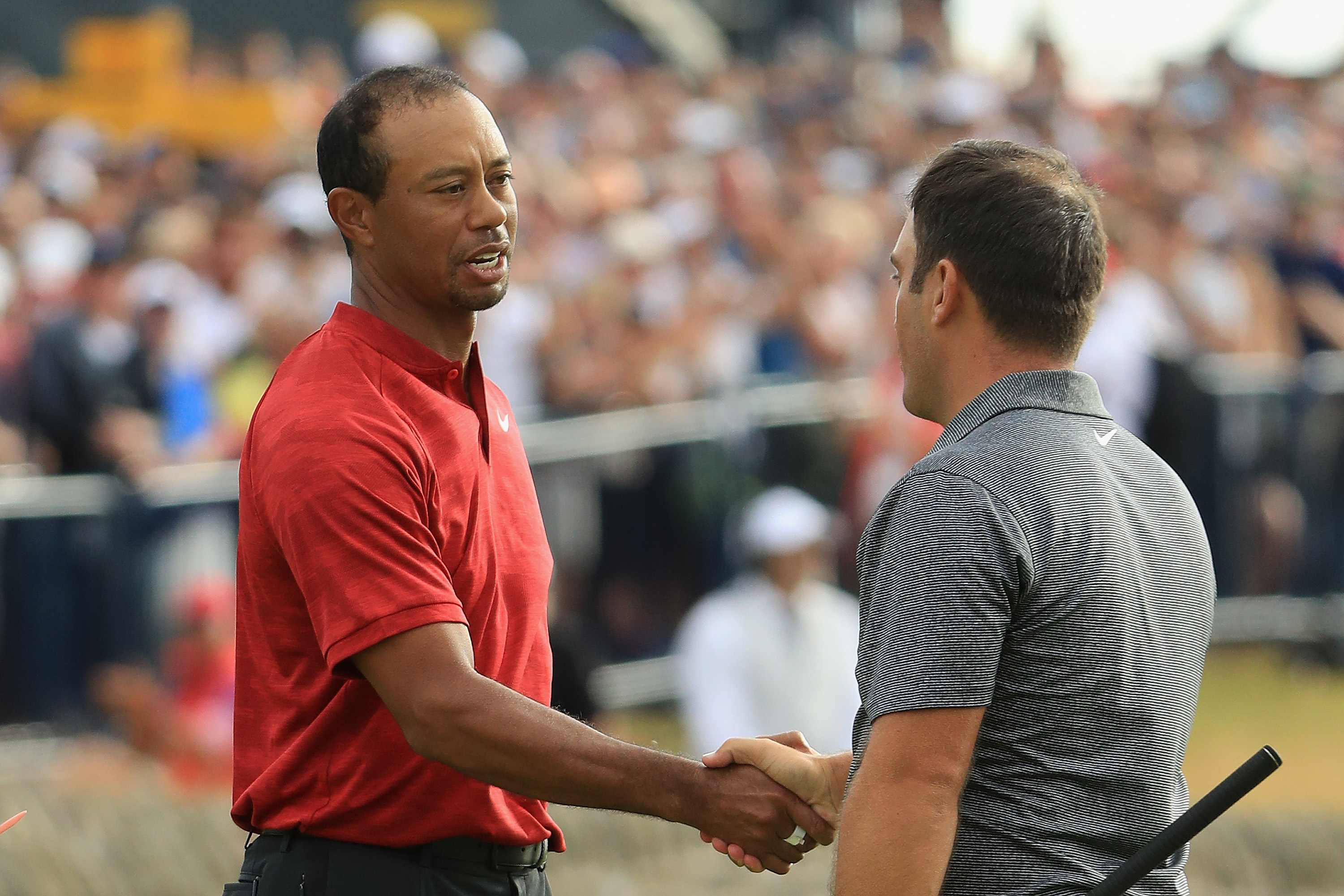 Francesco Molinari is congratulated by Tiger Woods after the final round of the 147th Open at Carnoustie.